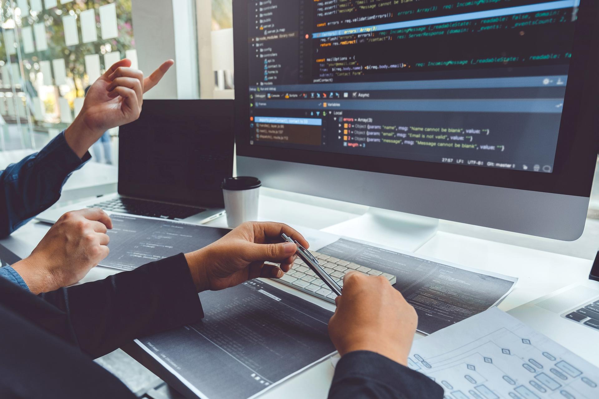 Developing programmer Development Website design and coding technologies working in software company office